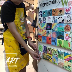 Student handicraft of a wall of mini canvases