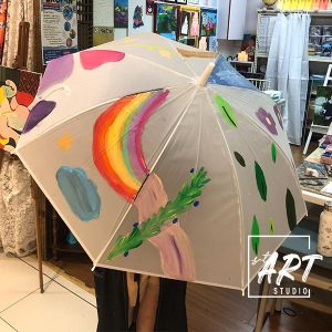 Student handicraft of a rainbow umbrella