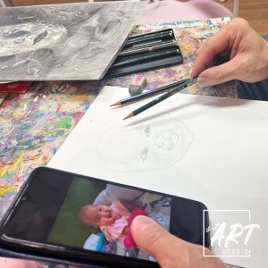 Student sketch art of a baby portrait
