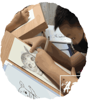 Children practising drawing techniques at their boards